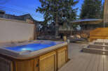 Enjoy luxurious outdoor living in this stunning property! Featuring a beautiful hot tub, a spacious deck, and a comfortable seating area, this home is perfect for relaxation and entertaining.
