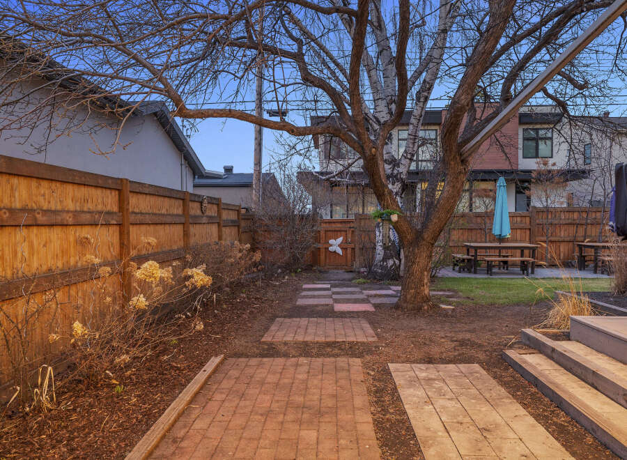 This stunning property boasts a beautifully landscaped backyard, perfect for outdoor entertaining.
