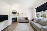 Step into this inviting living space, perfect for relaxation and entertaining.