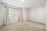 This inviting room features a neutral color palette, creating a versatile space ready for personalization.