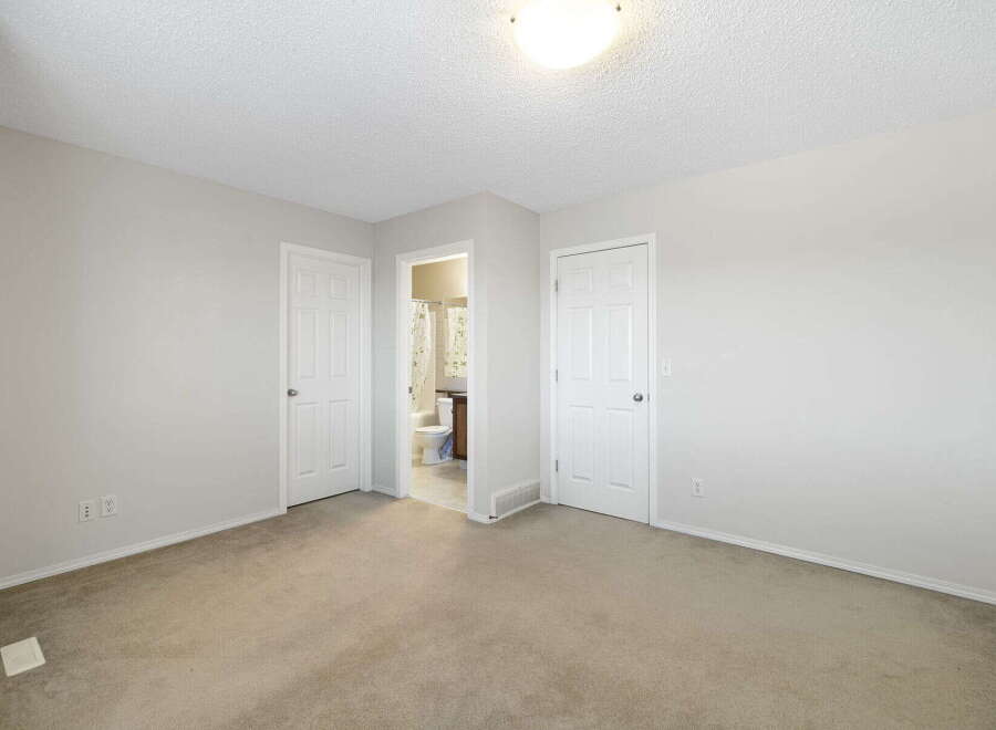 This inviting property boasts a spacious interior with neutral tones and ample natural light.