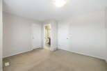 This inviting property boasts a spacious interior with neutral tones and ample natural light.