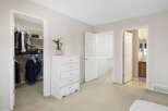 Step into this inviting bedroom, featuring a spacious walk-in closet perfect for organizing your wardrobe.