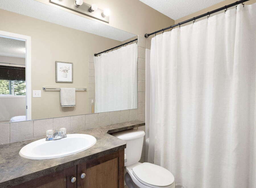 This inviting bathroom features a clean and modern design, perfect for relaxation.