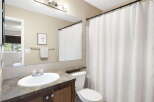 This inviting bathroom features a clean and modern design, perfect for relaxation.