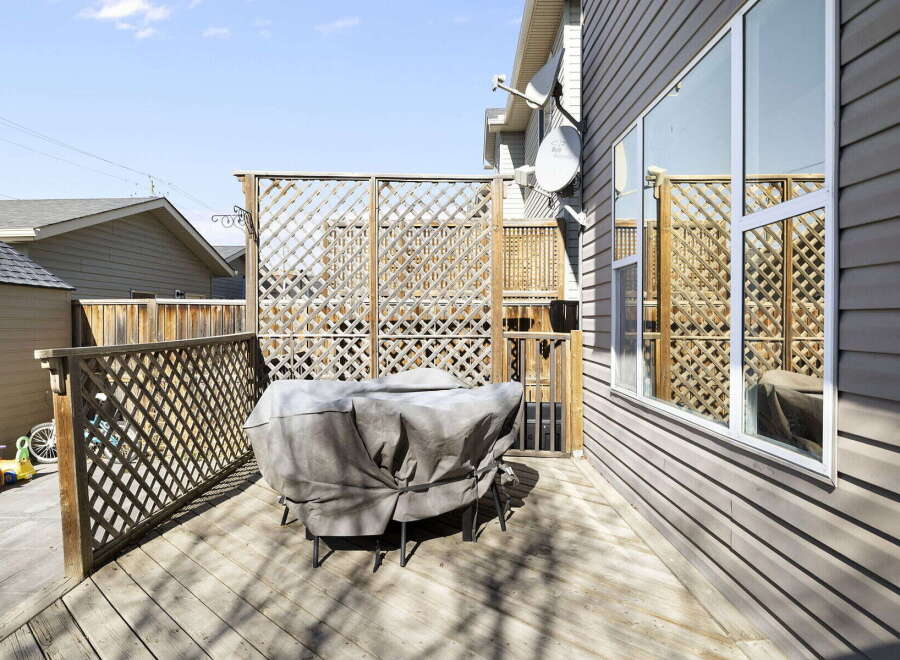 Enjoy outdoor living on this beautiful deck! This property features a spacious deck, perfect for entertaining or relaxing.