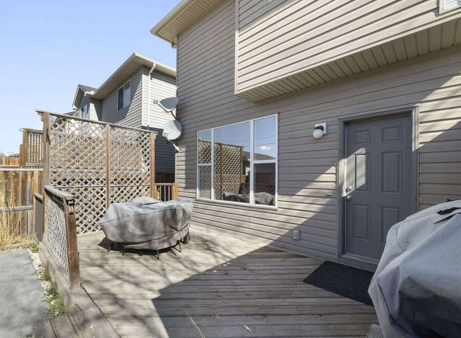 Enjoy outdoor living on this beautiful deck! This property features a spacious deck, perfect for entertaining or relaxing.