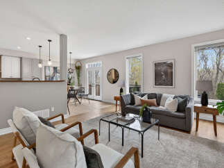 Step into luxury with this stunning property, featuring a spacious living room perfect for entertaining.