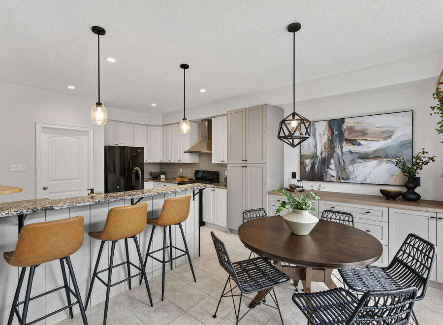 Step into this stunning kitchen, featuring a stylish breakfast bar with comfortable seating.