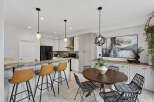 Step into this stunning kitchen, featuring a stylish breakfast bar with comfortable seating.