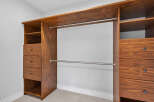 This custom-built closet offers ample storage and organization.