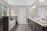 Step into luxury with this stunning bathroom featuring a sleek design and modern amenities.