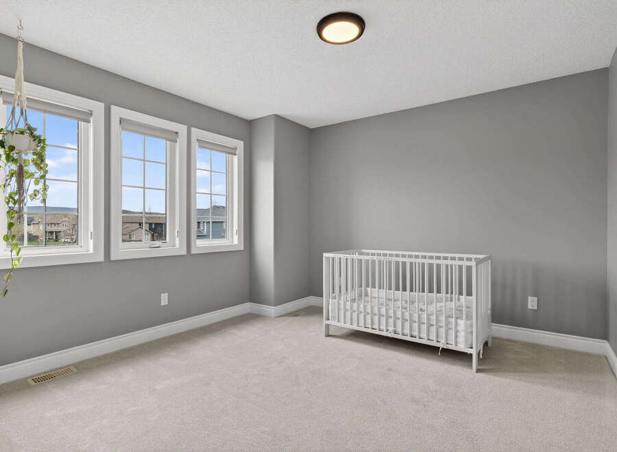 This charming nursery boasts a serene ambiance, perfect for creating a peaceful haven for your little one.