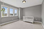 This charming nursery boasts a serene ambiance, perfect for creating a peaceful haven for your little one.