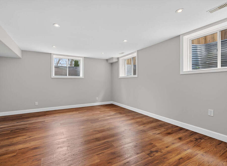 Discover the potential of this inviting space! This room features beautiful hardwood floors, creating a warm and welcoming atmosphere.