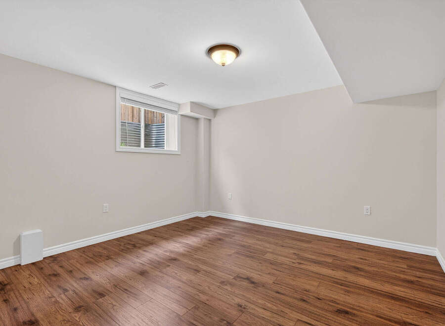 Discover the potential of this inviting space! This room features beautiful hardwood floors, creating a warm and welcoming atmosphere.