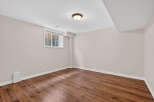 Discover the potential of this inviting space! This room features beautiful hardwood floors, creating a warm and welcoming atmosphere.