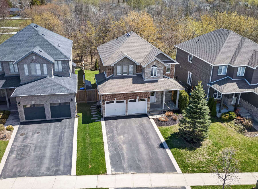 Discover this stunning property featuring a beautifully designed exterior with a combination of brick and stone accents.