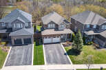 Discover this stunning property featuring a beautifully designed exterior with a combination of brick and stone accents.