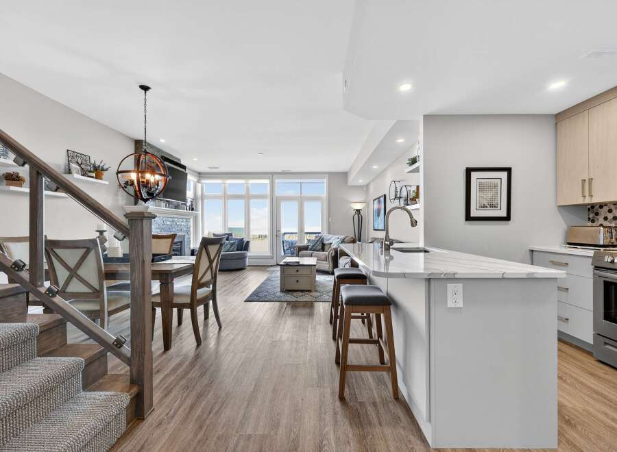 Step into luxury with this stunning property, boasting an open-concept design that seamlessly blends the kitchen, dining, and living areas.