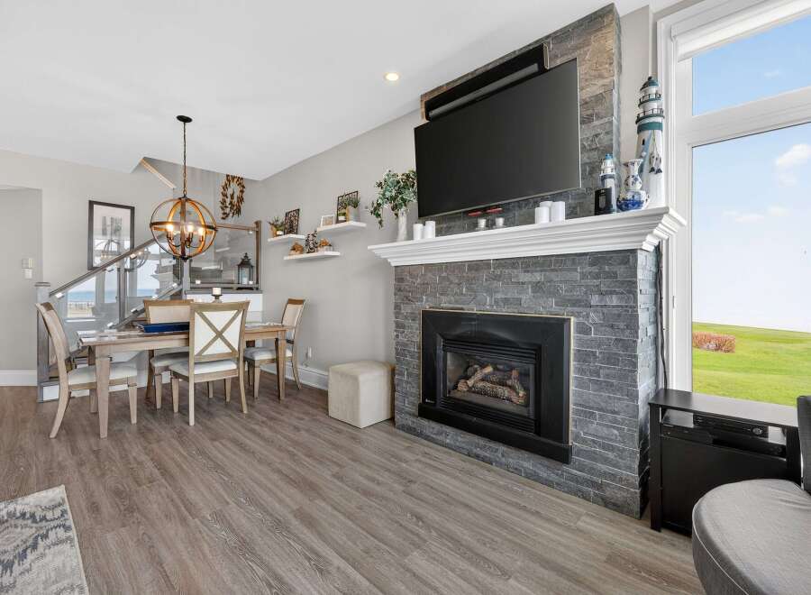 This stunning property boasts a cozy fireplace, perfect for those chilly evenings.