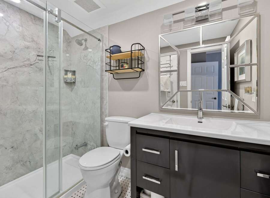 This stunning bathroom boasts a modern design with sleek finishes.