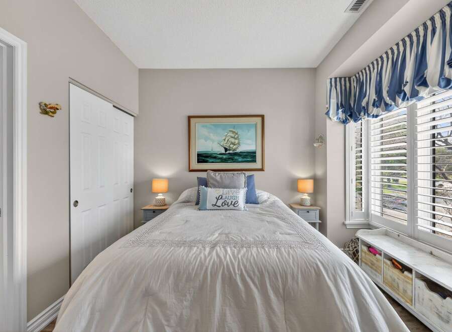 This charming bedroom offers a cozy retreat with its inviting ambiance.