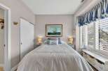 This charming bedroom offers a cozy retreat with its inviting ambiance.