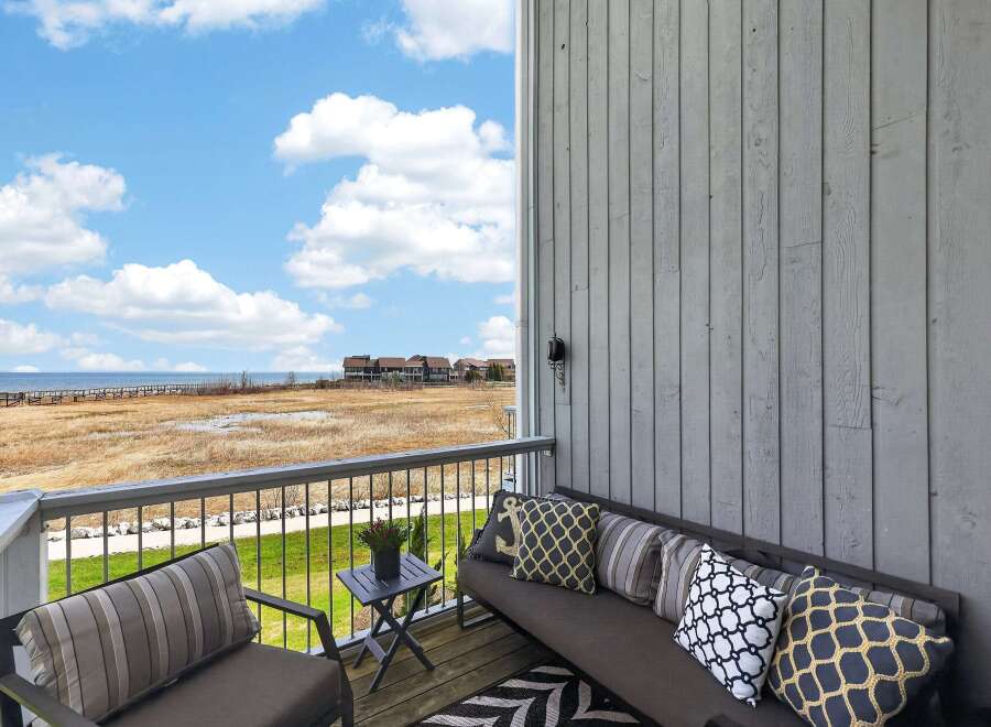 Enjoy breathtaking views from this stunning balcony overlooking the serene landscape.