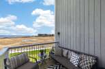 Enjoy breathtaking views from this stunning balcony overlooking the serene landscape.
