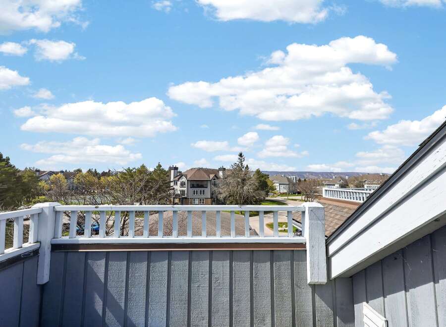 Enjoy stunning views from this beautiful property! This home features a spacious deck, perfect for relaxing and entertaining.
