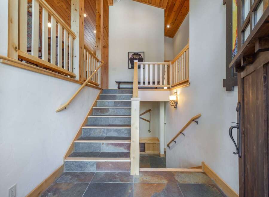 Step into luxury with this stunning property featuring a grand staircase and exquisite architectural details.