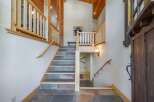 Step into luxury with this stunning property featuring a grand staircase and exquisite architectural details.