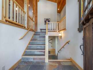 Step into luxury with this stunning property featuring a grand staircase and exquisite architectural details.
