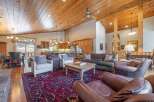 This stunning property boasts a spacious open-concept living area with a gourmet kitchen and a cozy fireplace.