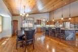 Step into luxury with this stunning kitchen featuring a unique stone island and custom cabinetry.