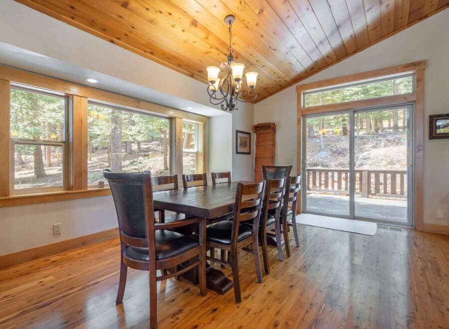 This stunning dining room boasts a warm and inviting atmosphere, perfect for hosting gatherings.