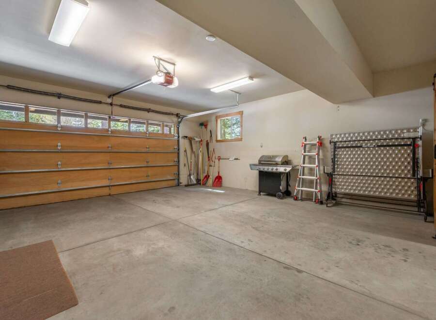 This spacious garage offers ample room for vehicles and storage.