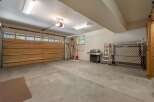 This spacious garage offers ample room for vehicles and storage.