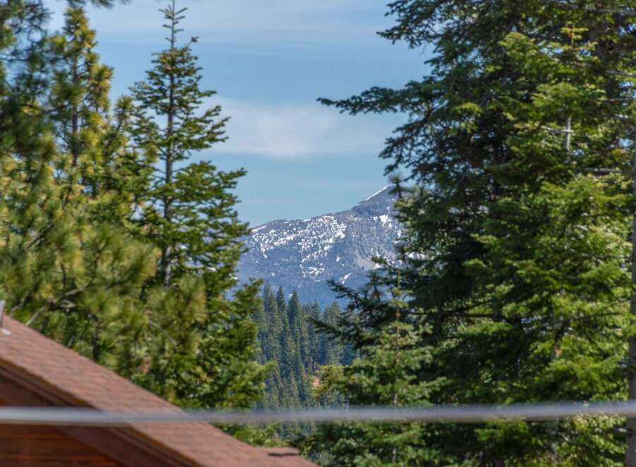 Nestled amidst the serene beauty of nature, this property offers breathtaking views of majestic mountains.