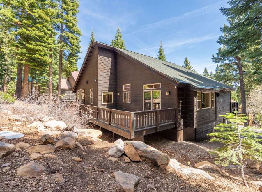 Nestled amidst towering trees, this charming cabin offers a serene escape.