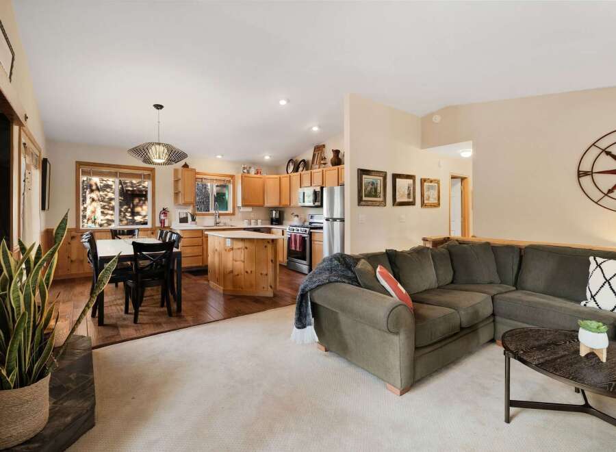This stunning property boasts a spacious open-concept living area, perfect for entertaining.