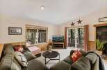 This cozy living room features a comfortable sectional sofa, perfect for relaxing after a long day.