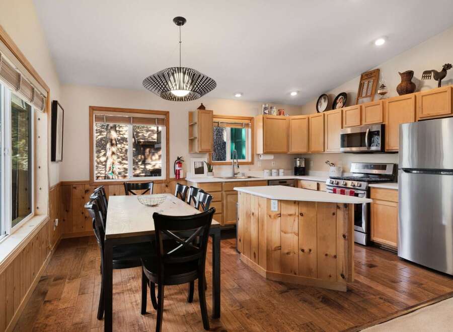 Step into this inviting kitchen, featuring a stylish island and ample counter space, perfect for culinary adventures.