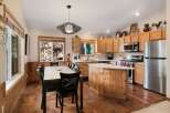 Step into this inviting kitchen, featuring a stylish island and ample counter space, perfect for culinary adventures.