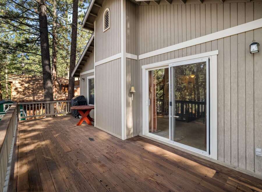 Enjoy the tranquility of this stunning property with a spacious deck, perfect for outdoor relaxation.