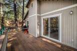 Enjoy the tranquility of this stunning property with a spacious deck, perfect for outdoor relaxation.