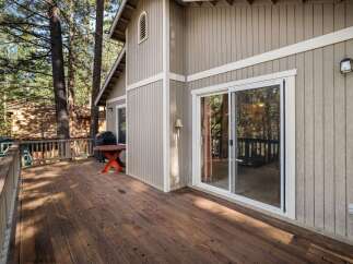 Enjoy the tranquility of this stunning property with a spacious deck, perfect for outdoor relaxation.