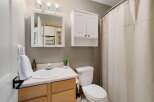 This charming bathroom features a bright and airy design, perfect for starting your day.