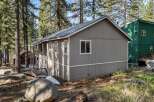 Nestled amidst towering trees, this charming property offers a serene escape.